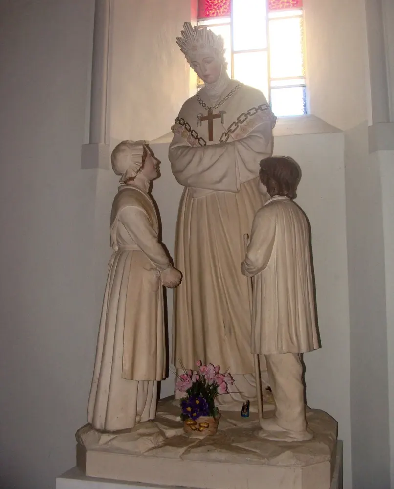 Statue of Our Lady of La Salette with the two children in the parish church at Corps